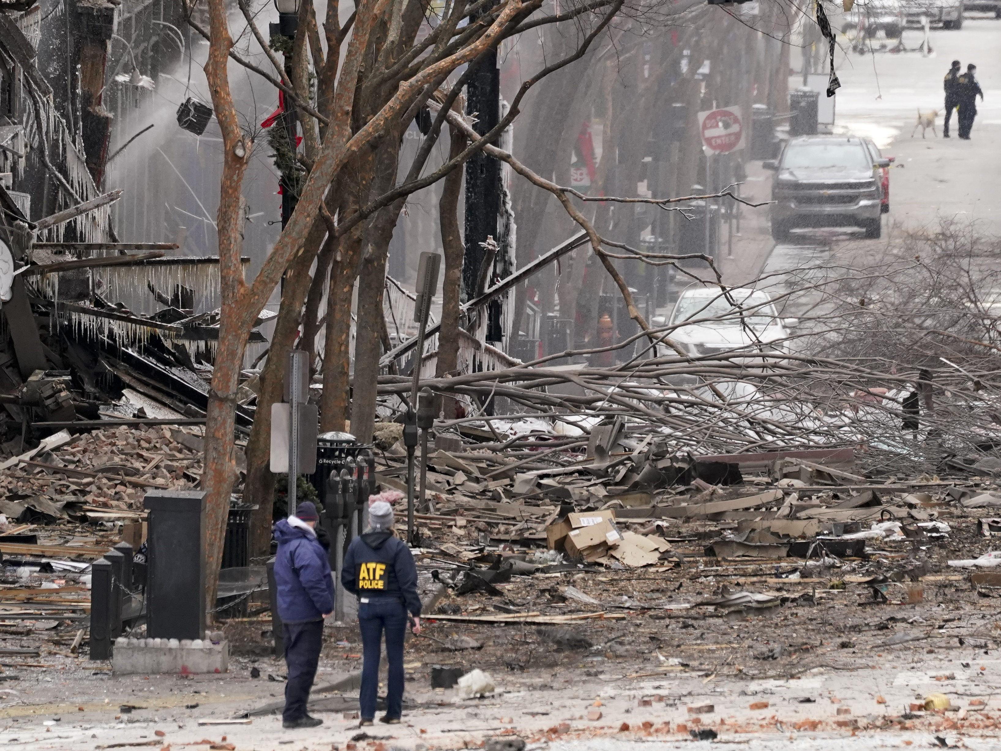 caption: Emergency personnel work near the scene of an explosion in downtown Nashville, Tenn., on Dec. 25.