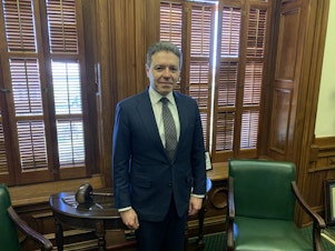 caption: Jonathan Mitchell, pictured on April 27 inside the statehouse in Austin, Texas, is credited with devising the legal strategy behind the near-total abortion ban in Texas known as S.B. 8.