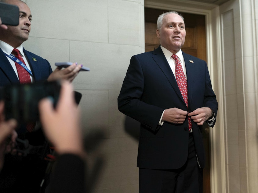 caption: House Majority Leader Steve Scalise, R-La., talks to reporters as he leaves Republicans' closed-door forum to hear from the candidates for speaker of the House on Tuesday.