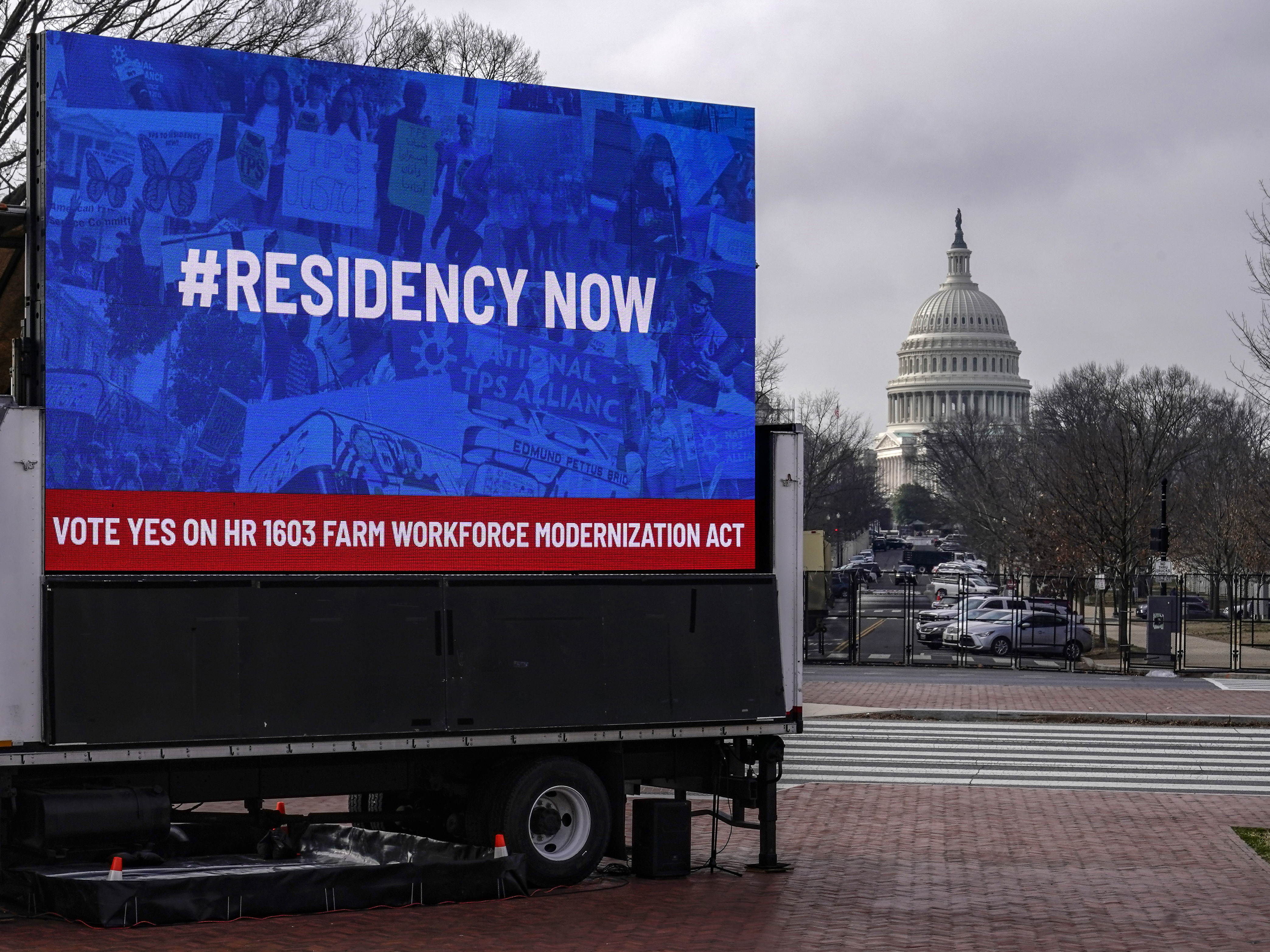 caption: An installation erected near the U.S. Capitol showcases support for the American Dream and Promise Act and the Farm Workforce Modernization Act on March 17, 2021.