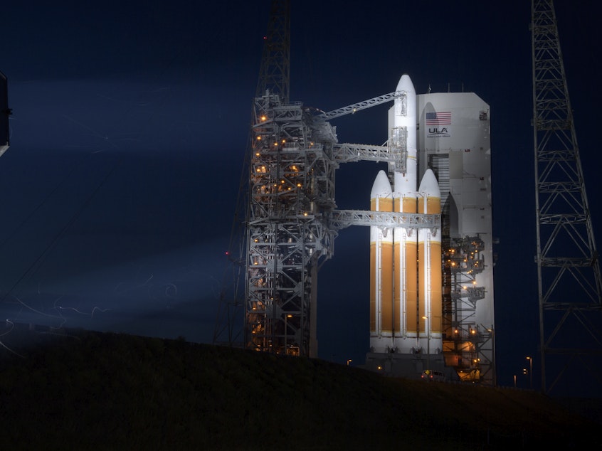 caption: In this 2018 handout provided by NASA, the United Launch Alliance Delta IV Heavy rocket prepares to launch with the Parker Solar Probe onboard.