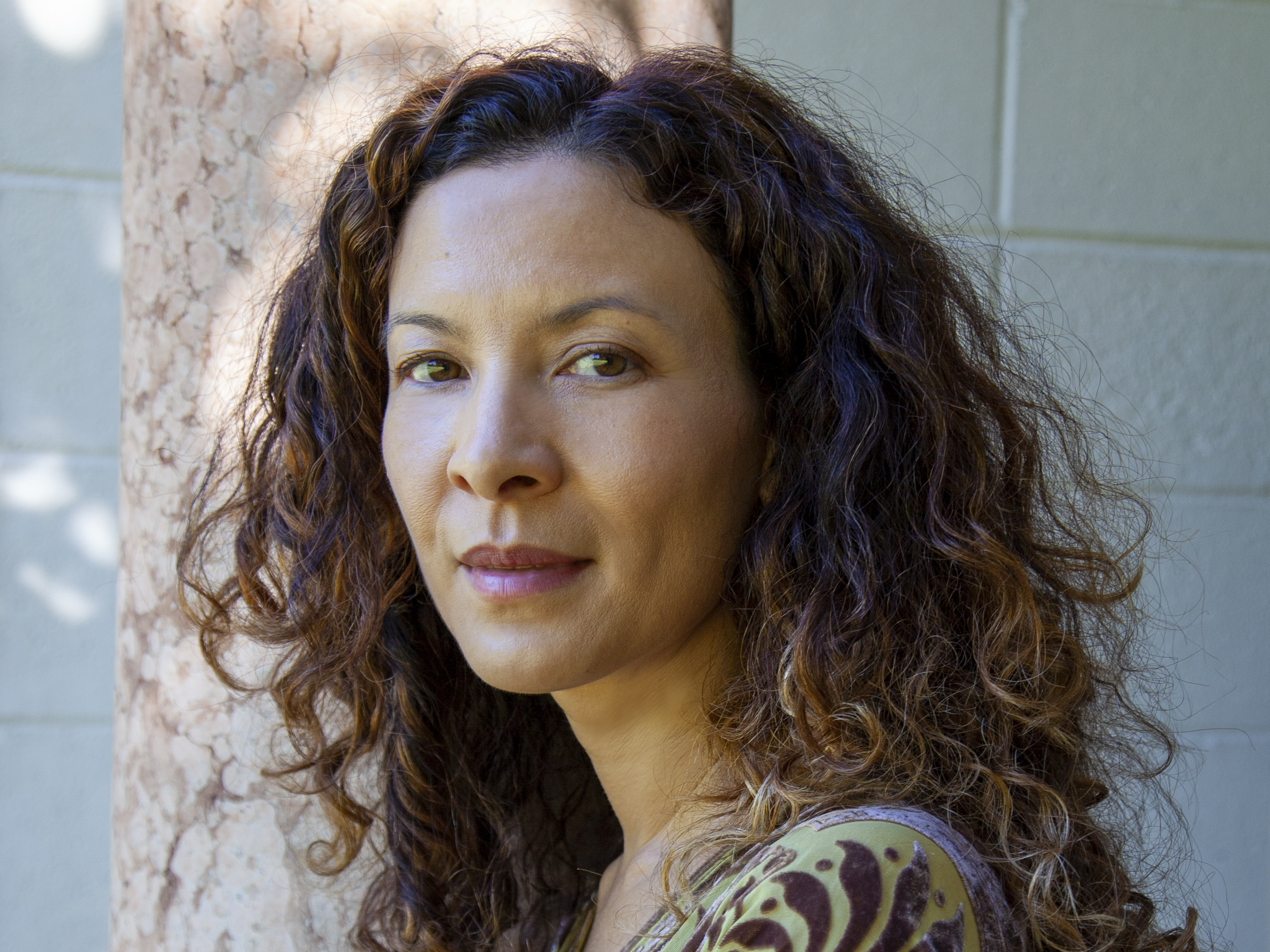 caption: "I've made a bunch of romantic albums," Los Angeles-based singer-songwriter Mia Doi Todd says. "I think my world view is full of pink glasses."