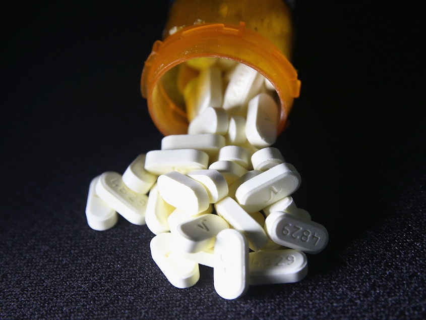 caption: Oxycodone pain pills prescribed for a patient with chronic pain are photographed in 2016. Attorneys unveiled a plan Friday morning which they say would move the nation closer to a global settlement of lawsuits stemming from the deadly opioid crisis.