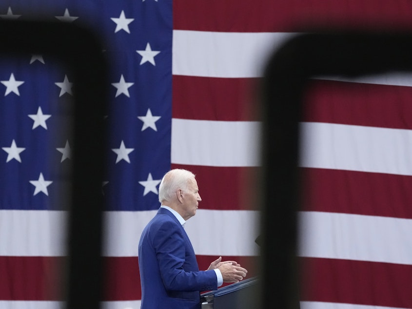 caption: President Biden speaks at the Arcosa Wind Towers in Belen, N.M., on Wednesday.