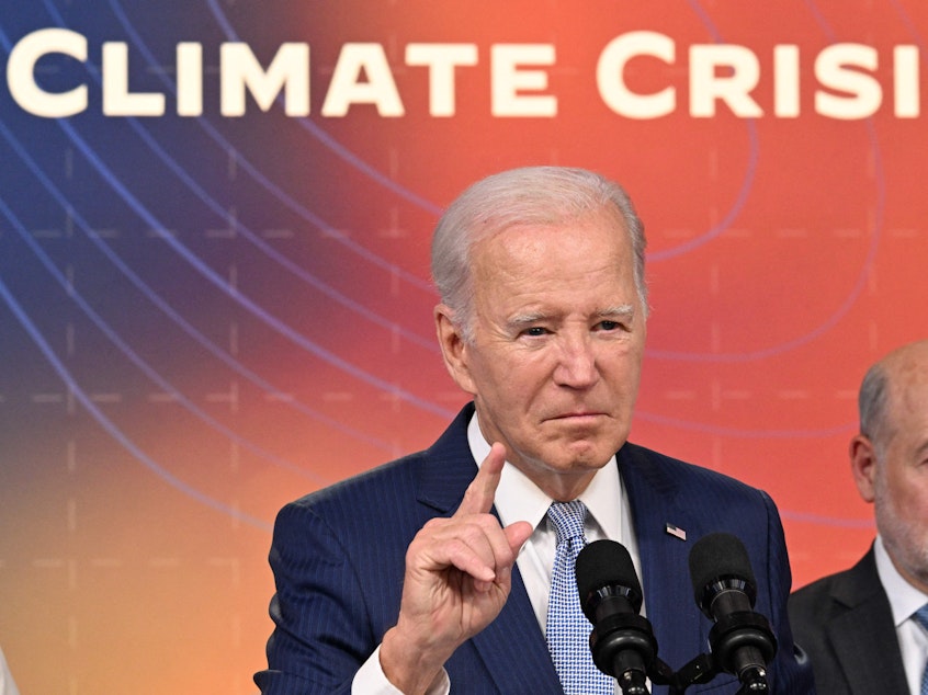 caption: President Biden, seen here at a briefing on extreme heat conditions on July 27, wants communities to do more to formally plan for extremely hot summers.