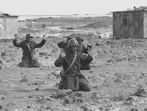 caption: Syrian soldiers raise their hands in surrender on Oct. 10, 1973, in the Golan Heights, five days into the Yom Kippur War.