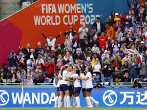 caption: United States players celebrate after Sophia Smith (11) scored their first goal of the Women's World Cup against Vietnam on July 22, 2023. Referees have been adding plenty of extra time due to injuries, substitutions and goal celebrations.