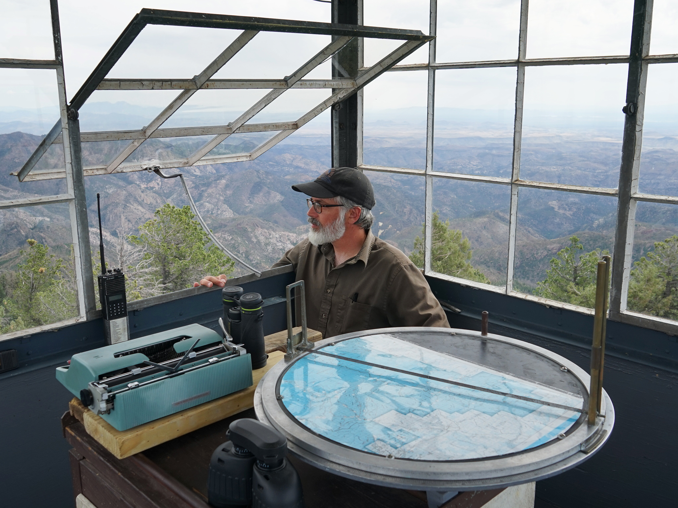 caption: Philip Connors has spent 17 summers as a fire lookout in the Gila National Forest. Lookouts are the eyes in the forest, even as the forests they watch have changed, shaped by developers, shifting land management policies and climate change.
