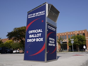 caption: A ballot drop box in Detroit where voters can drop off absentee ballots instead of using the mail.