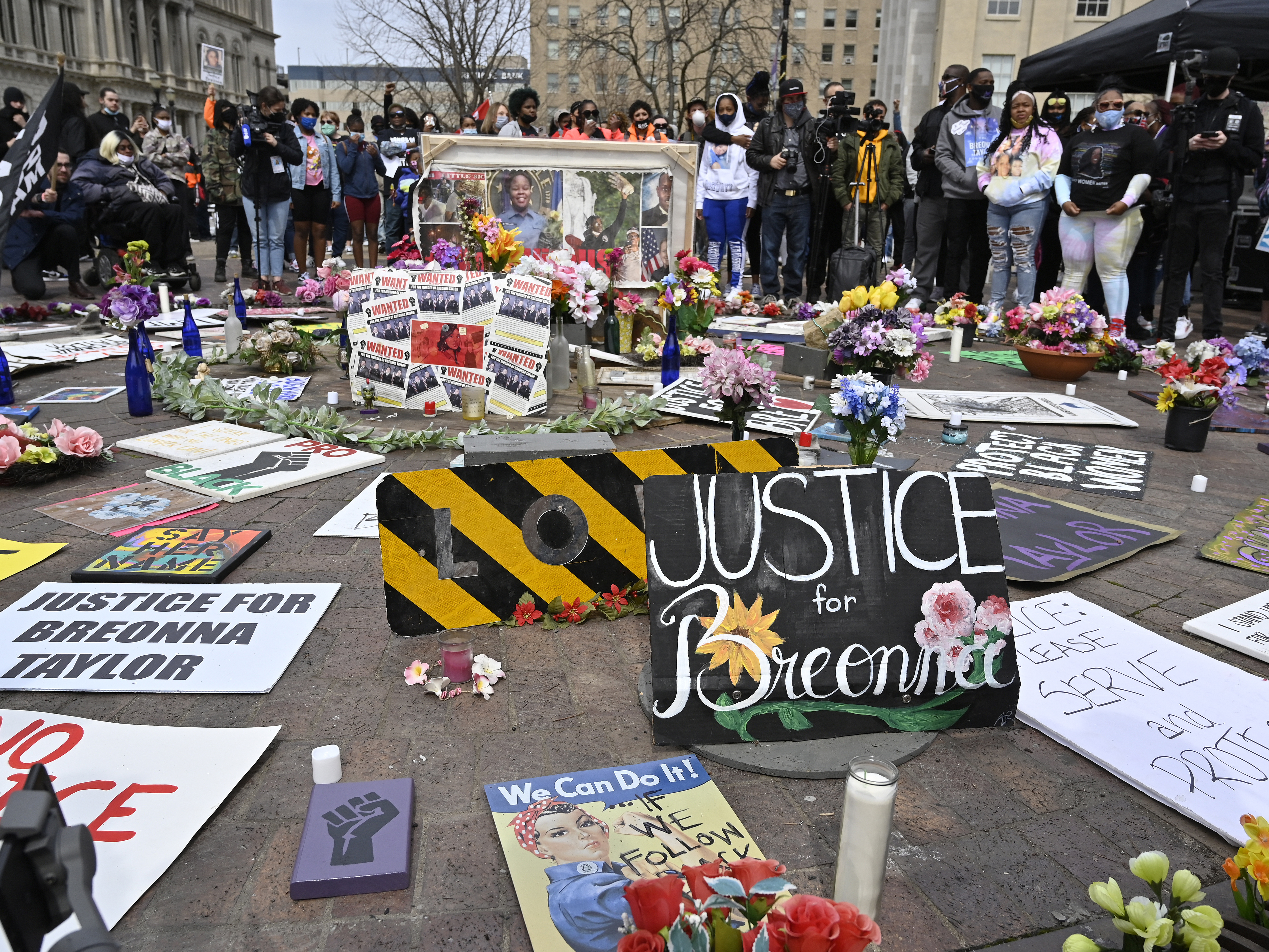 caption: Protesters gathered at a memorial a Louisville, Ky. park on March 13, 2021, the anniversary of Breonna Taylor's killing. Jonathan Mattingly, one of the officers involved in the fatal raid, is facing widespread criticism for planning to publish a book about it.