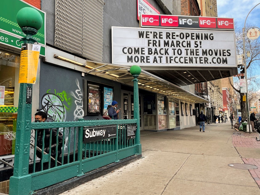 caption: The marquee of the IFC Center in Manhattan welcomes viewers back after being closed nearly one year