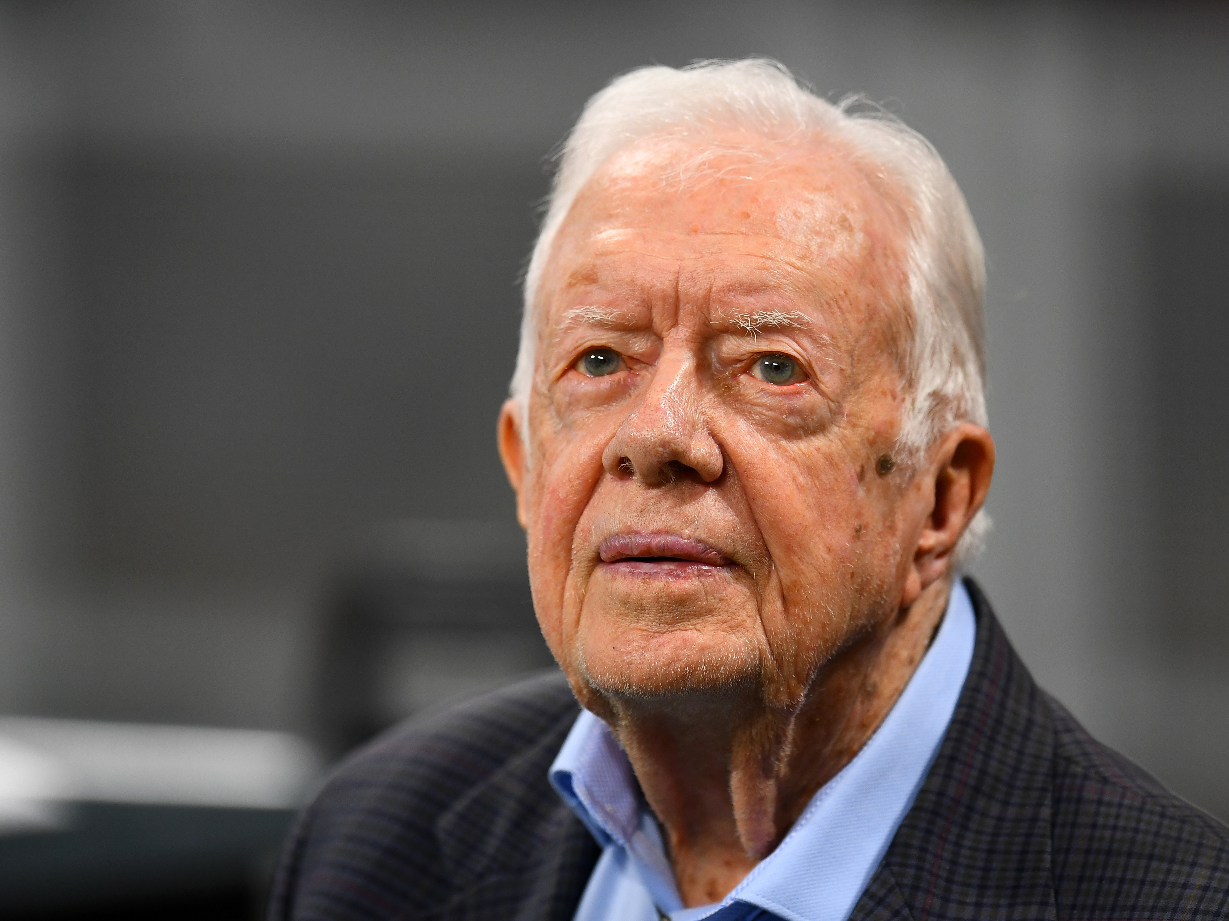 caption: Former President Jimmy Carter has devoted much of his post-presidential life to observing elections overseas. He is aksing GOP gubernatorial candidate Brian Kemp to step down from his position as Georgia secretary of state in order "to ensure the confidence of our citizens."