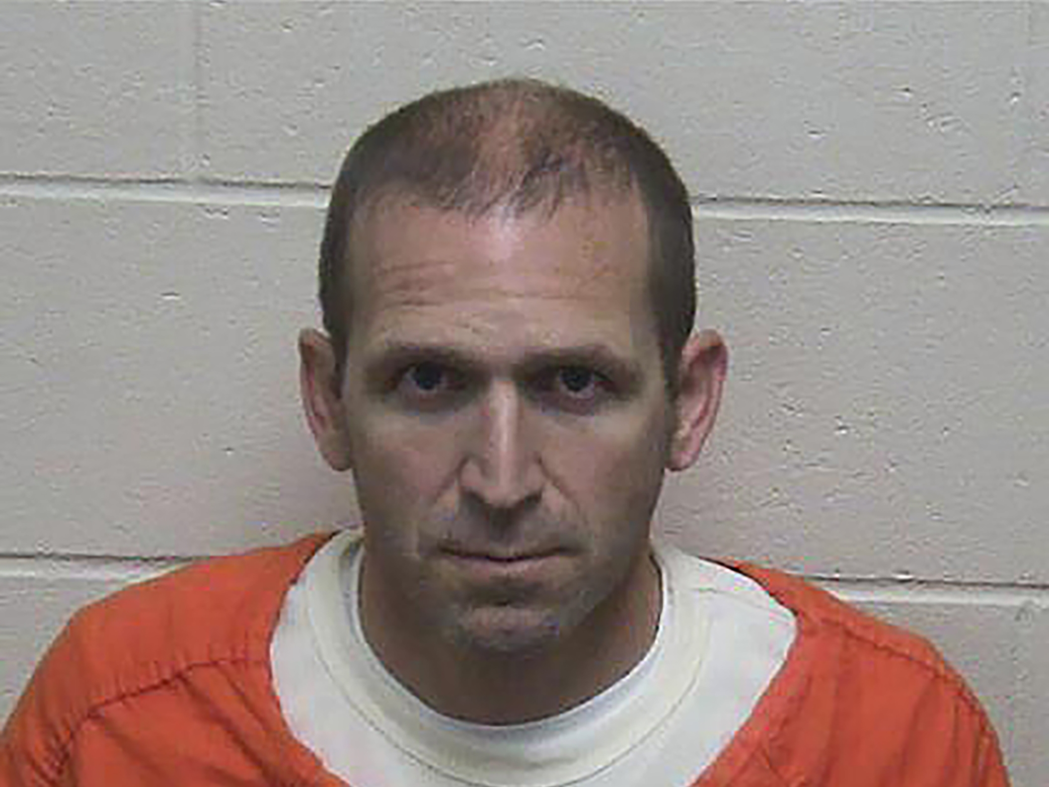 caption: This photo released by the Green Lake County Sheriff's Office in Wisconsin shows Ryan Borgwardt's booking photo on Tuesday.