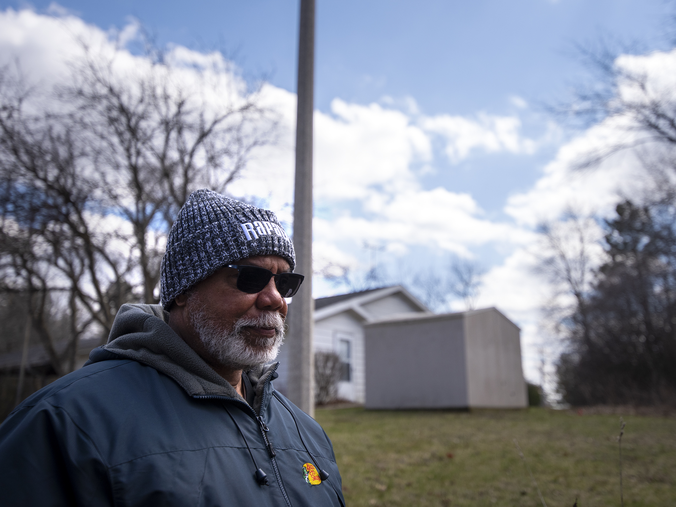 caption: Peter Baker walks near the clubhouse at Lake Ivanhoe on Saturday, April 16, 2022.