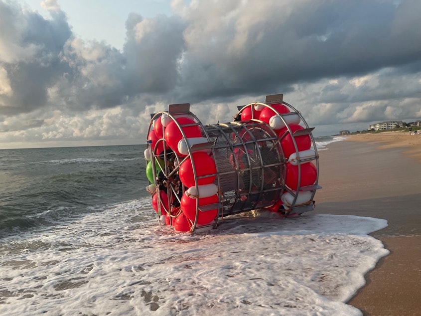 caption: Reza Baluchi was taken in by the U.S. Coast Guard last week while trying to cross the Atlantic in a "hydro pod" made of buoys. Authorities in Flagler County, Fla., responded to Baluchi and his vessel in 2021 and posted photos of his vessel on Facebook.
