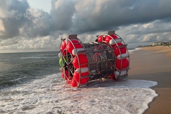 caption: Reza Baluchi was taken in by the U.S. Coast Guard last week while trying to cross the Atlantic in a "hydro pod" made of buoys. Authorities in Flagler County, Fla., responded to Baluchi and his vessel in 2021 and posted photos of his vessel on Facebook.