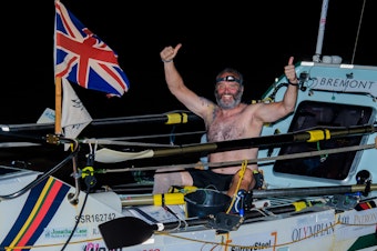caption: Lee Spencer, a 49-year-old single-leg amputee, celebrates after rowing solo across the Atlantic.