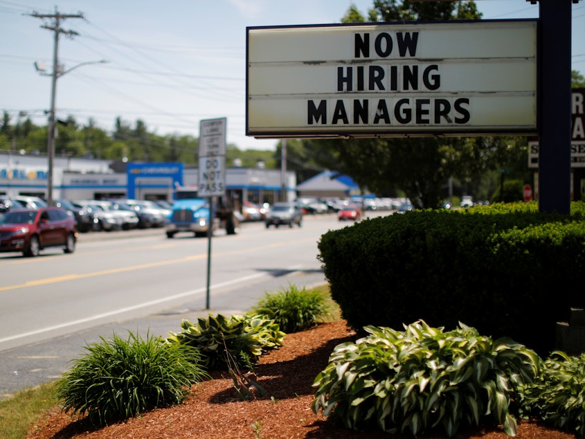 caption: Employers continued to add jobs in February, and the unemployment rate remained near historic lows.