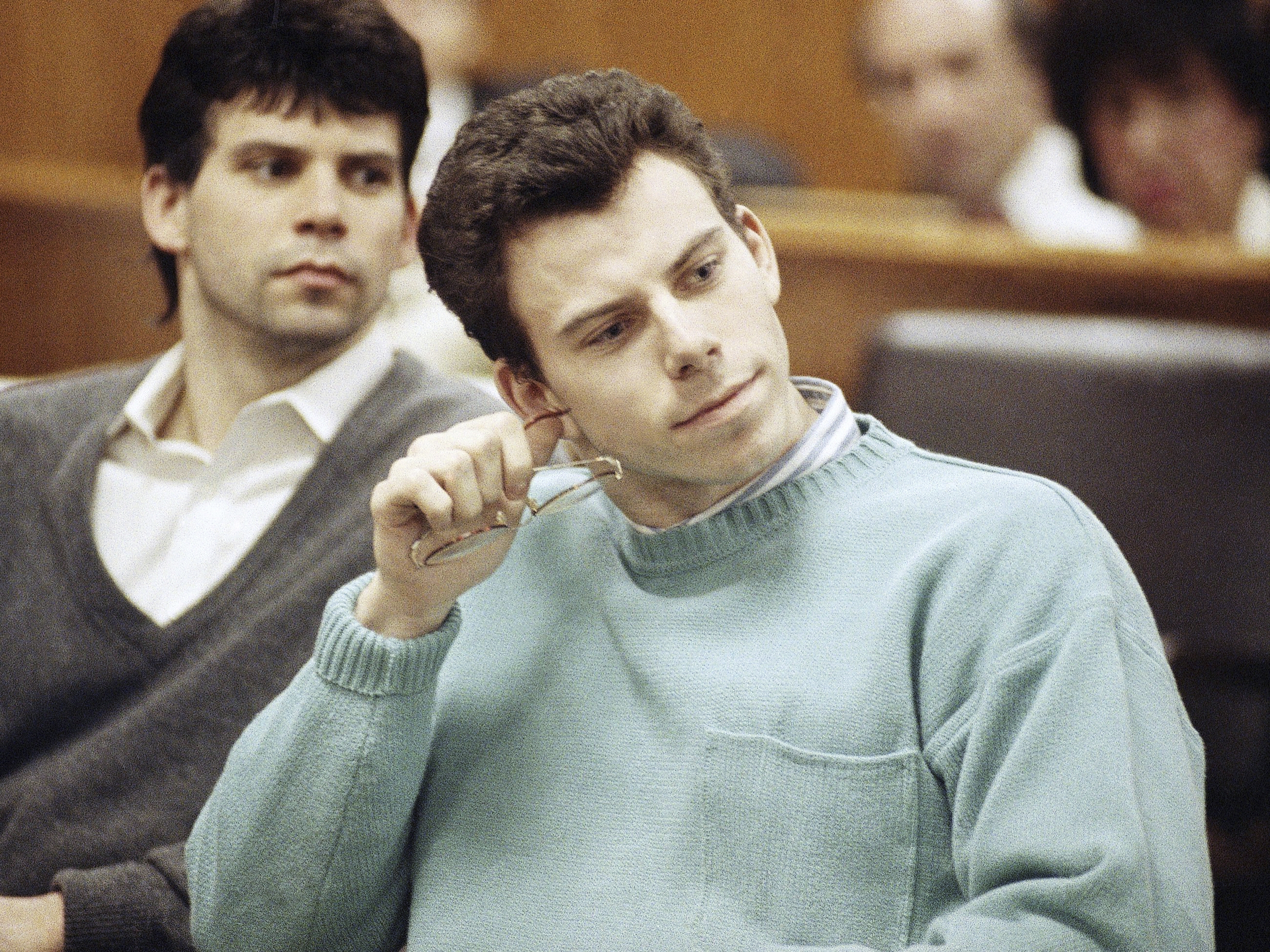 caption: Lyle (left) and Erik Menendez appear in court in 1991. They were convicted in the 1989 murders of their parents and sentenced to life in prison, but became eligible for parole in May.