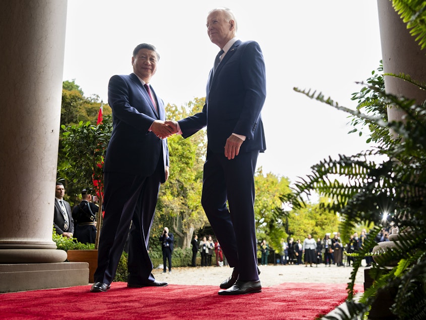 caption: U.S. President Joe Biden greets China's President President Xi Jinping at the Filoli Estate in Woodside, Calif., Wednesday, Nov, 15, 2023, on the sidelines of the Asia-Pacific Economic Cooperative conference.