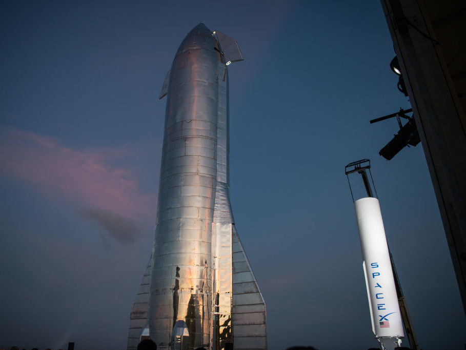 caption: A prototype of SpaceX's Starship stands at the company's Texas launch facility on Saturday. The Starship spacecraft is a massive vehicle designed to eventually be able to take people to the moon, Mars and beyond.