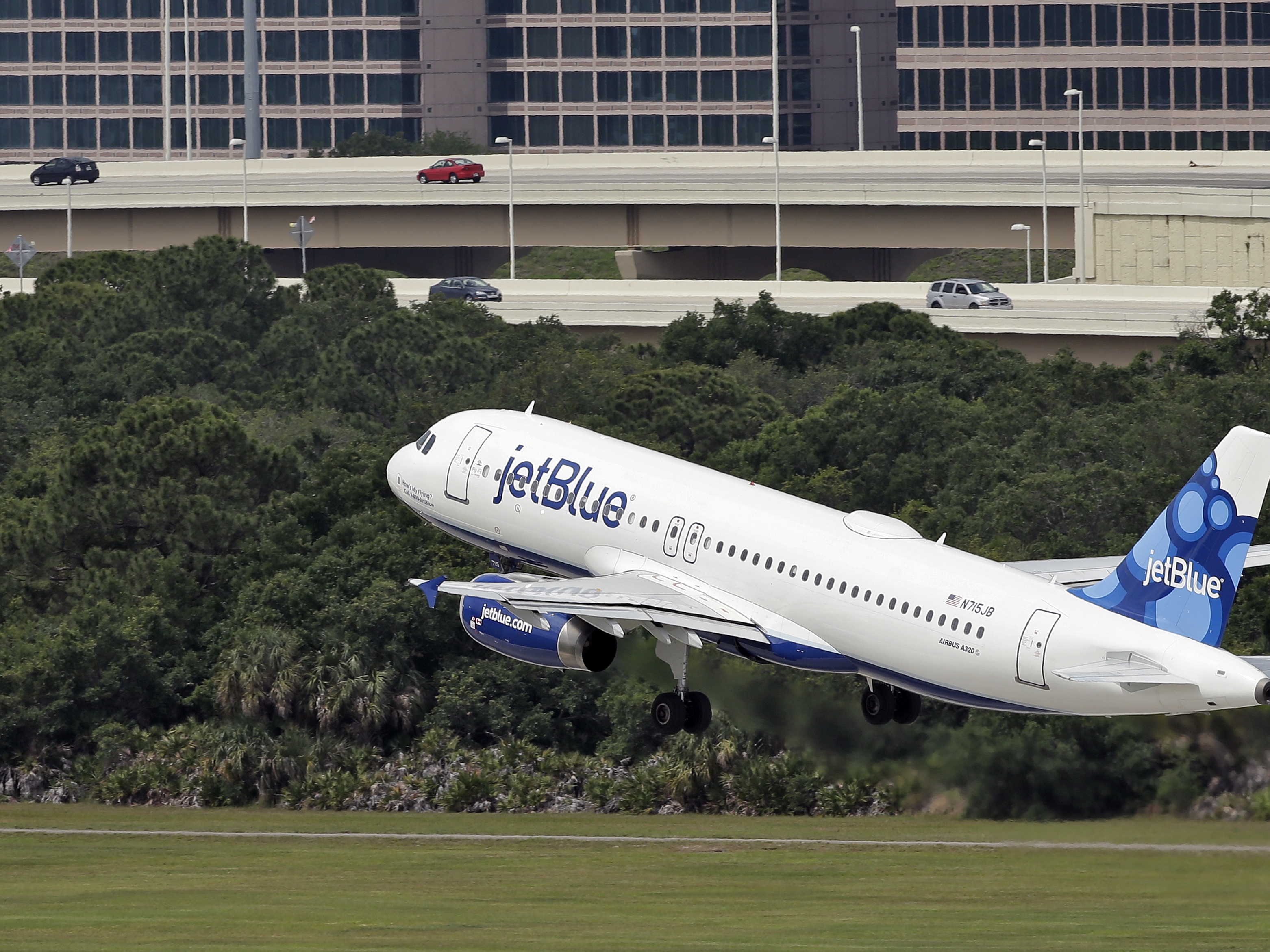 caption: A JetBlue Airways Airbus A320-232 takes off from the Tampa International Airport in Florida on May 15, 2014. Two bodies were found in the landing gear compartment of a JetBlue plane at Fort Lauderdale-Hollywood International Airport on Monday night, the airline said.