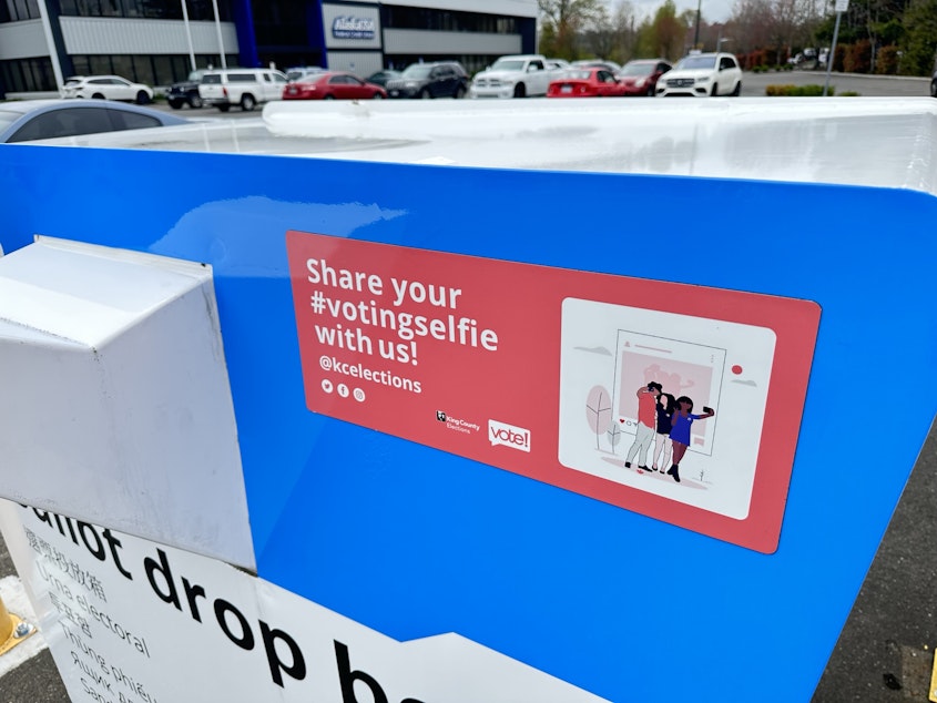 caption: The drive-through ballot drop box at King County elections in Renton.