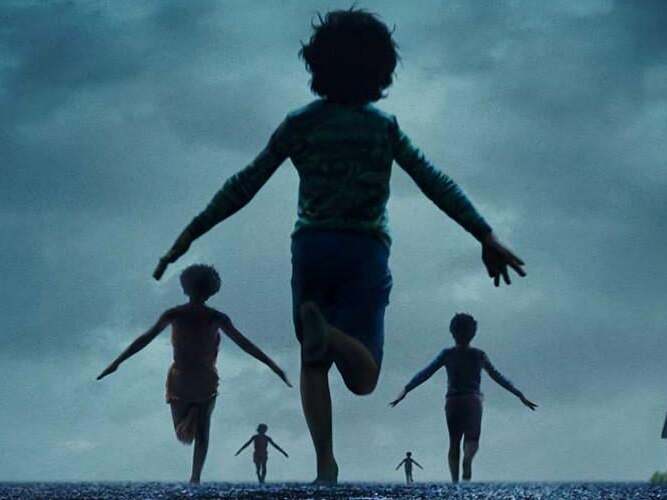 caption: Small-town life is upended when 17 children vanish in the middle of the night in <em>Weapons</em>.