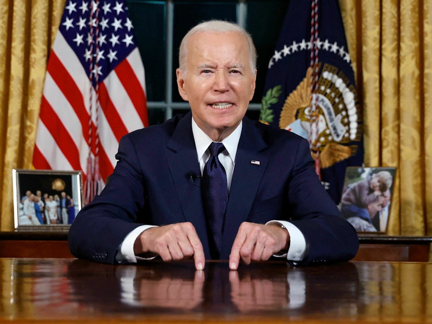 caption: President Biden used an Oval Office address to make the case that funding for Israel and Ukraine is in the national interest.