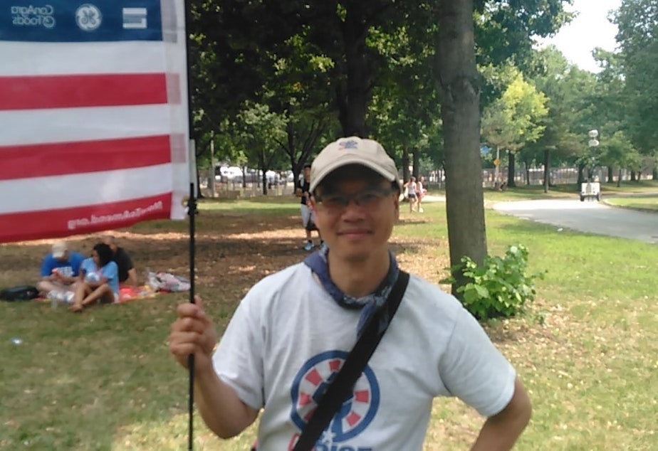 caption: Jonathan Tong, a school teacher from Kenmore, traveled to Philadelphia to protest outside the Democratic National Convention.