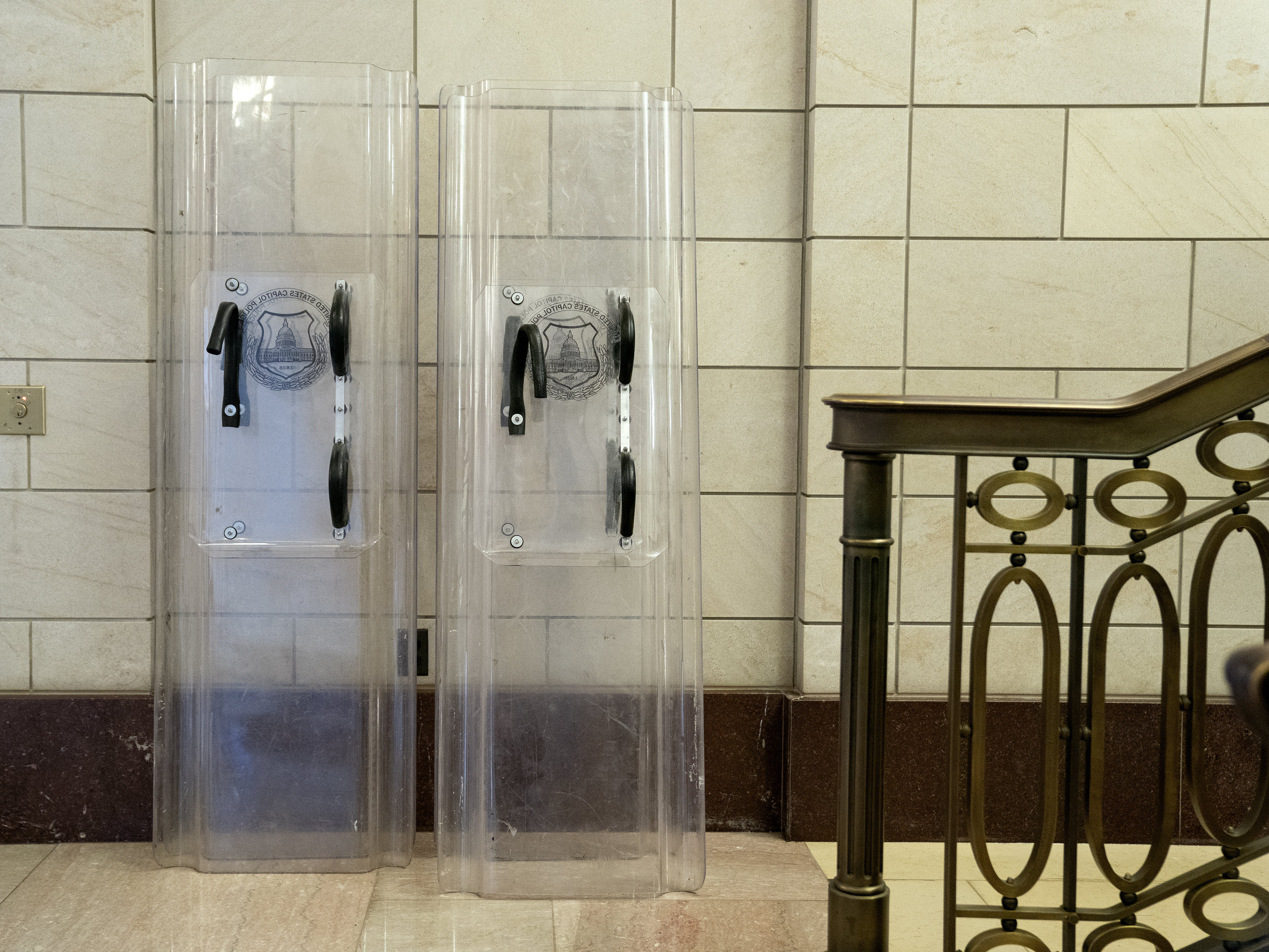 caption: Federal prosecutors are accusing Patrick Edward McCaughey III of using a police shield to pin an officer against a door during the Jan. 6 storming of the Capitol building.