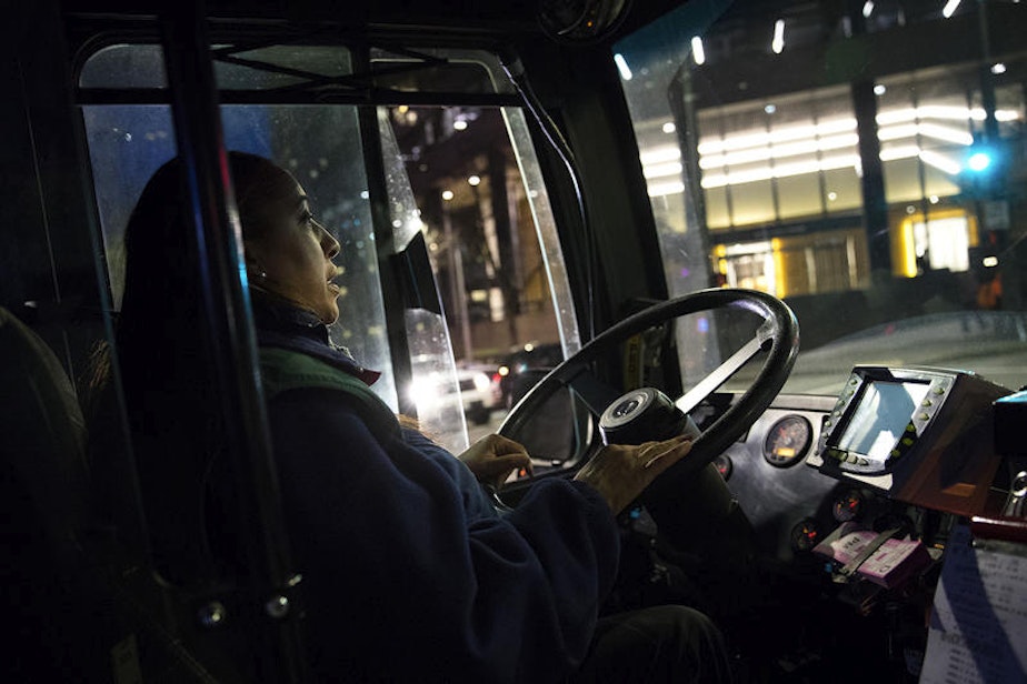 caption: Nichole Fabre drives the RapidRide E Line bus up and down Aurora. On a recent weekday morning, she started driving around 3:55 a.m., beginning in Seattle.