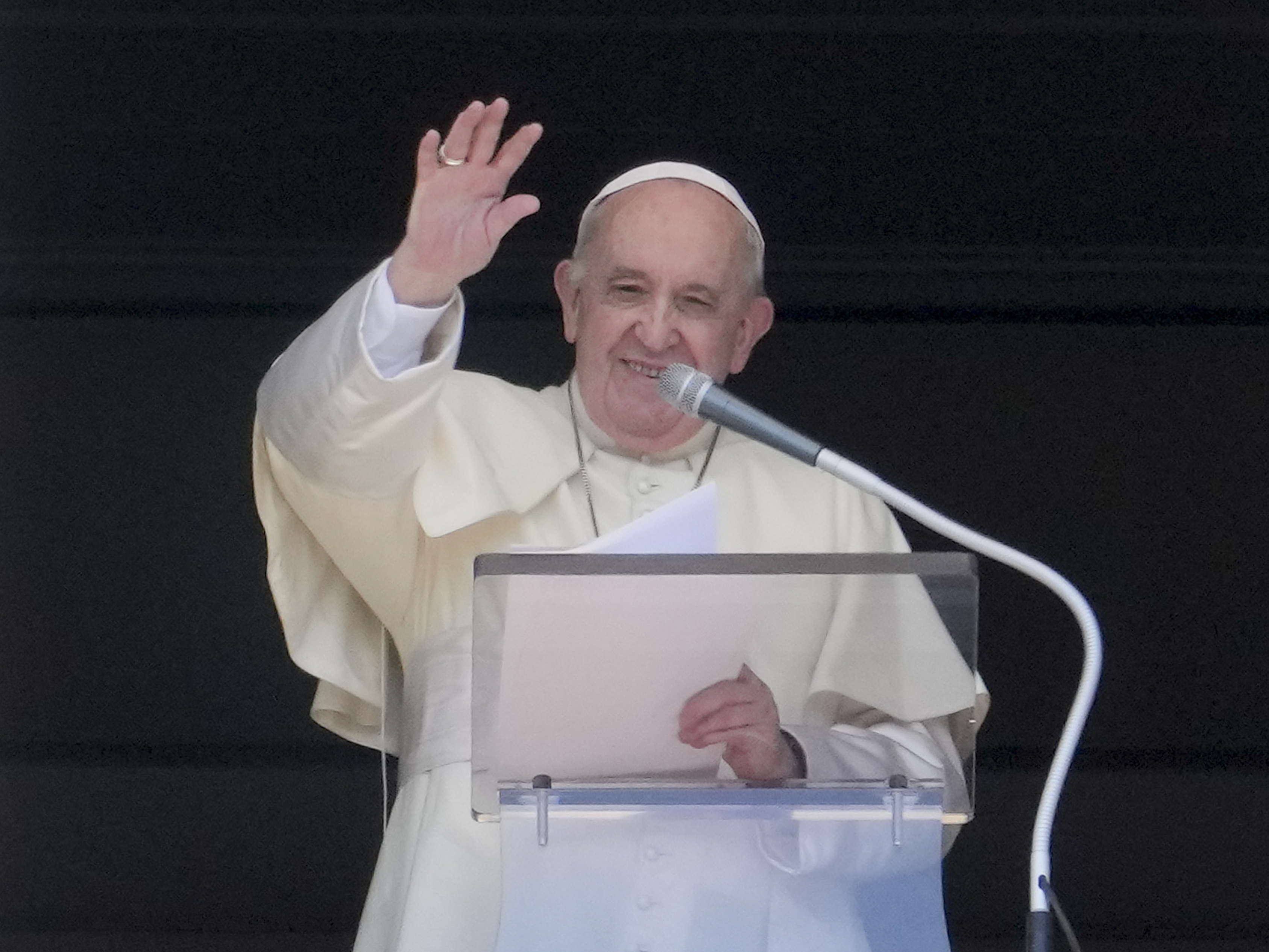 caption: Pope Francis delivers his blessing as he recites the Angelus noon prayer from the window of his studio overlooking St.Peter's Square, at the Vatican, Sunday, Sept. 5, 2021.