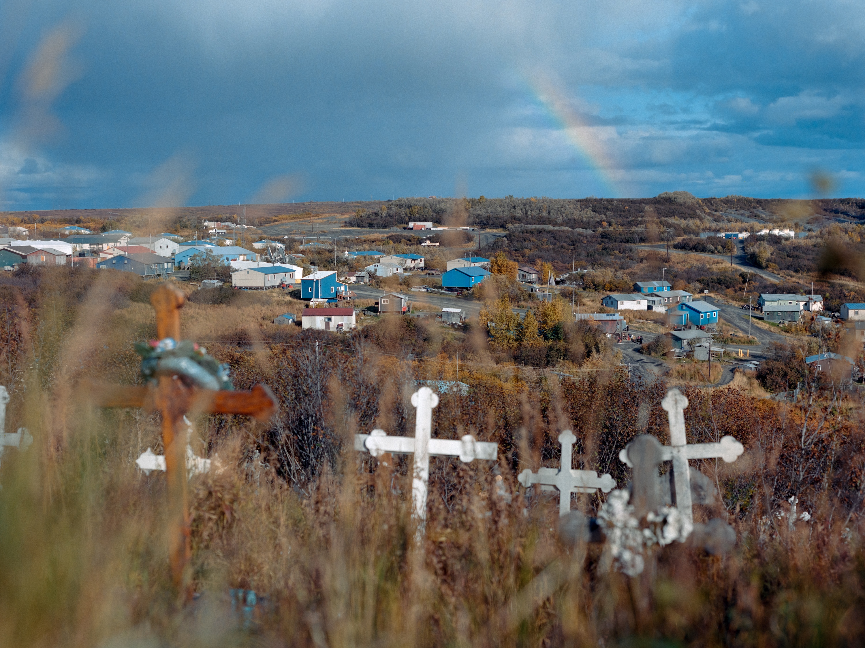caption: Sunrise view from the cemetery in Mountain Village, a community in Alaska’s Yukon-Kuskokwim Delta, the morning after Drake “Clayton” Wilde’s burial. Wilde was only 19 years old when he died by suicide, following a number of local teens who have taken their lives in recent years.