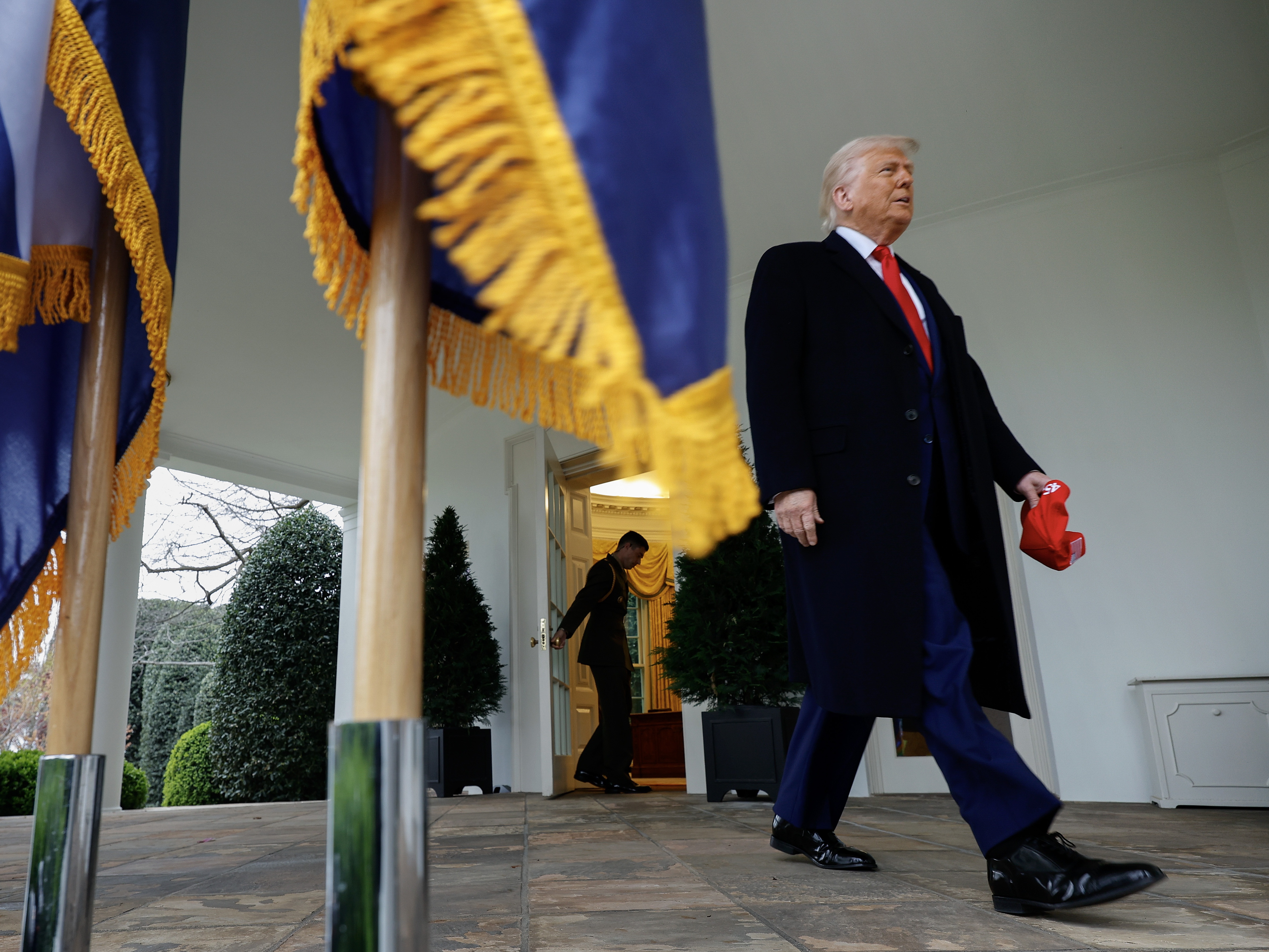 caption: President Trump walks out of the Oval Office to announce tariffs on what he called "Liberation Day" on April 2, 2025.