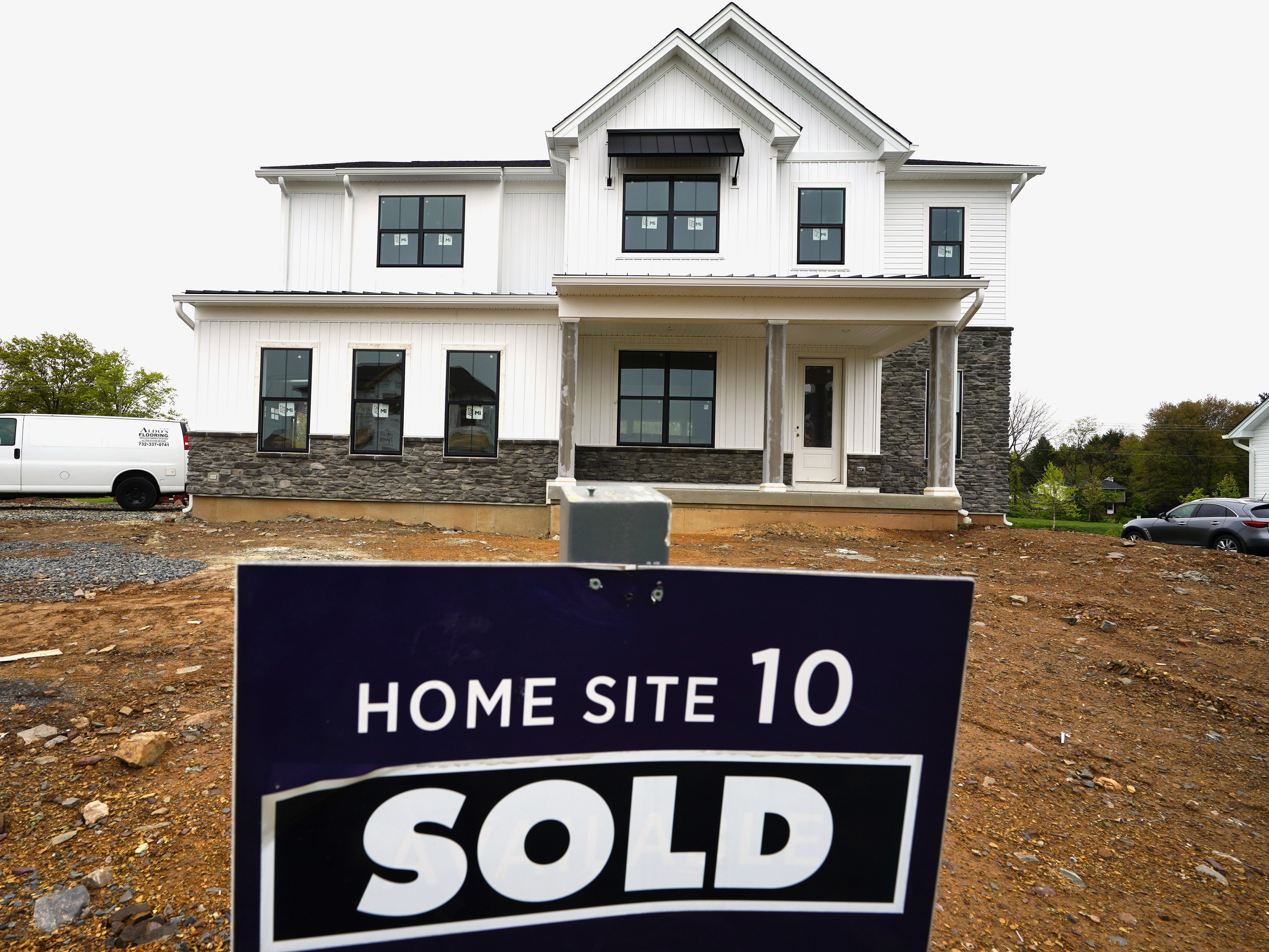 caption: Sales of new homes like this one in Eagleville, Pa., are up modestly, while existing home sales have plummeted amid a housing shortage, record high prices and high mortgage rates.