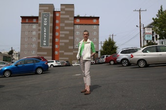 caption: Lora Radford at one of the free parking lots run by the West Seattle Junction Association