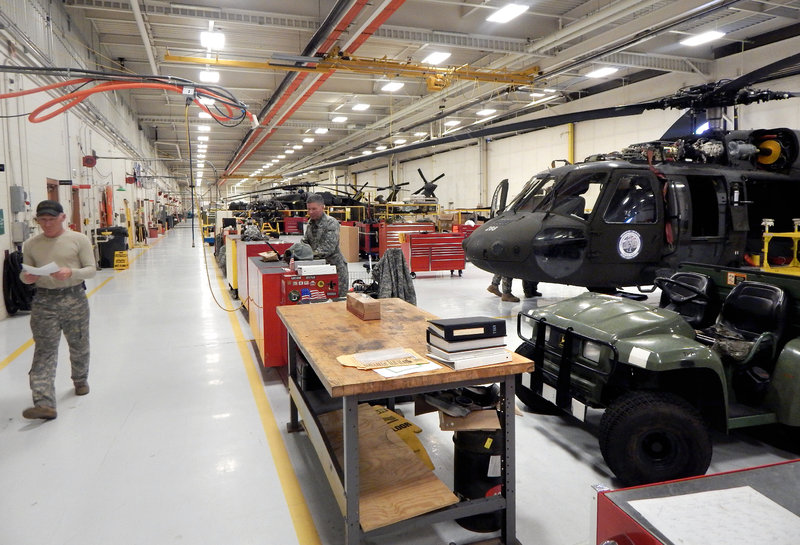caption: A view inside the Washington National Guard Army Aviation Support Facility on Joint Base Lewis McChord in February. As Congress cuts $500 billion from the Defense Department budget, the National Guard and active Army are competing for the same dollars.