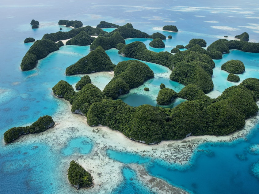 caption: Rock Islands in Palau, a UNESCO World Heritage Site and a popular dive location. Retailers who break the "reef-toxic" sunscreen ban will face fines of $1,000.