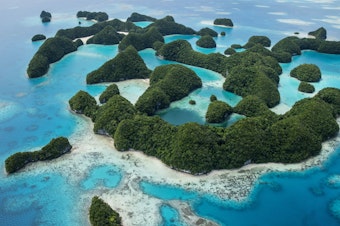 caption: Rock Islands in Palau, a UNESCO World Heritage Site and a popular dive location. Retailers who break the "reef-toxic" sunscreen ban will face fines of $1,000.