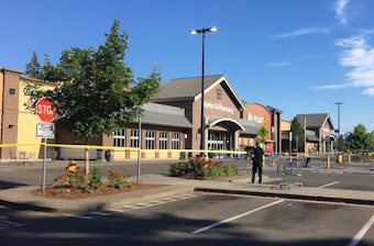 caption: Police block the scene outside a Walmart in Tumwater where a gunman shot a driver, then was himself shot to death on Sunday afternoon.
