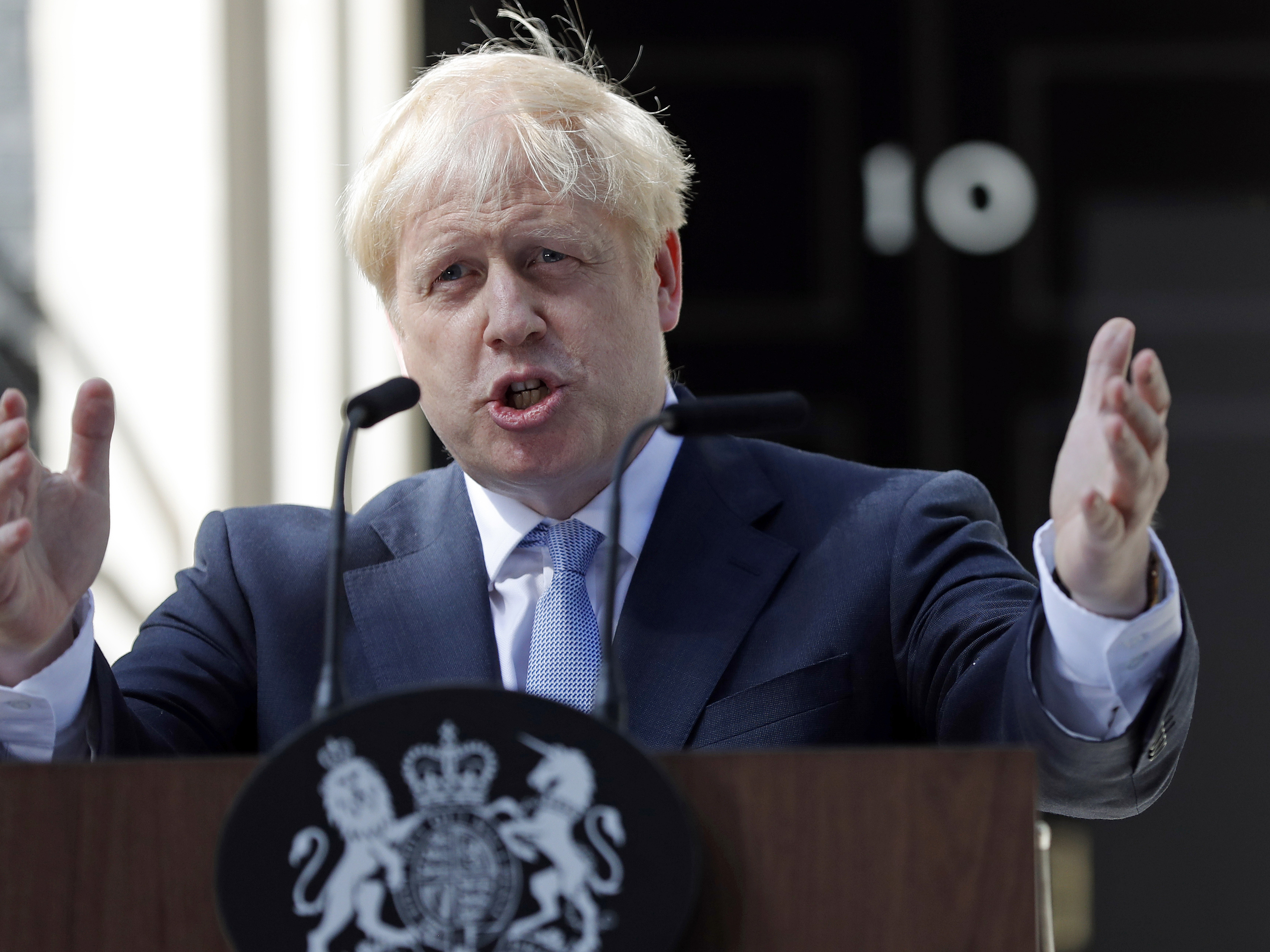 caption: A leaked Brexit document predicts a "catastrophic collapse" of the U.K.'s infrastructure if Britain leaves the EU with no deal. Above, British Prime Minister Boris Johnson gestures as he speaks outside 10 Downing Street in London in July.