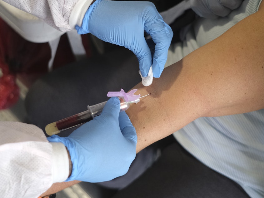caption: Deputy Chief Patricia Cassidy of the Jersey City Police Department has blood drawn to test for coronavirus antibodies in Jersey City, N.J., on Monday.