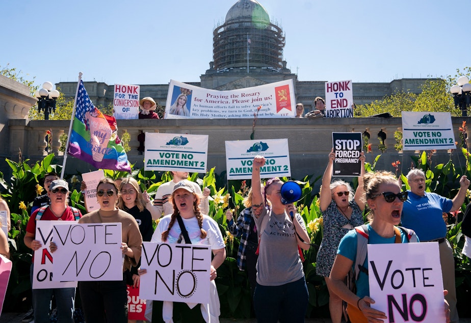 caption: Kentucky voters have rejected an amendment that would have said the state constitution contains no right to an abortion. Earlier, people rallied on the steps of the Kentucky State Capitol in Frankfort to encourage voters to vote yes on Amendment 2, which failed.