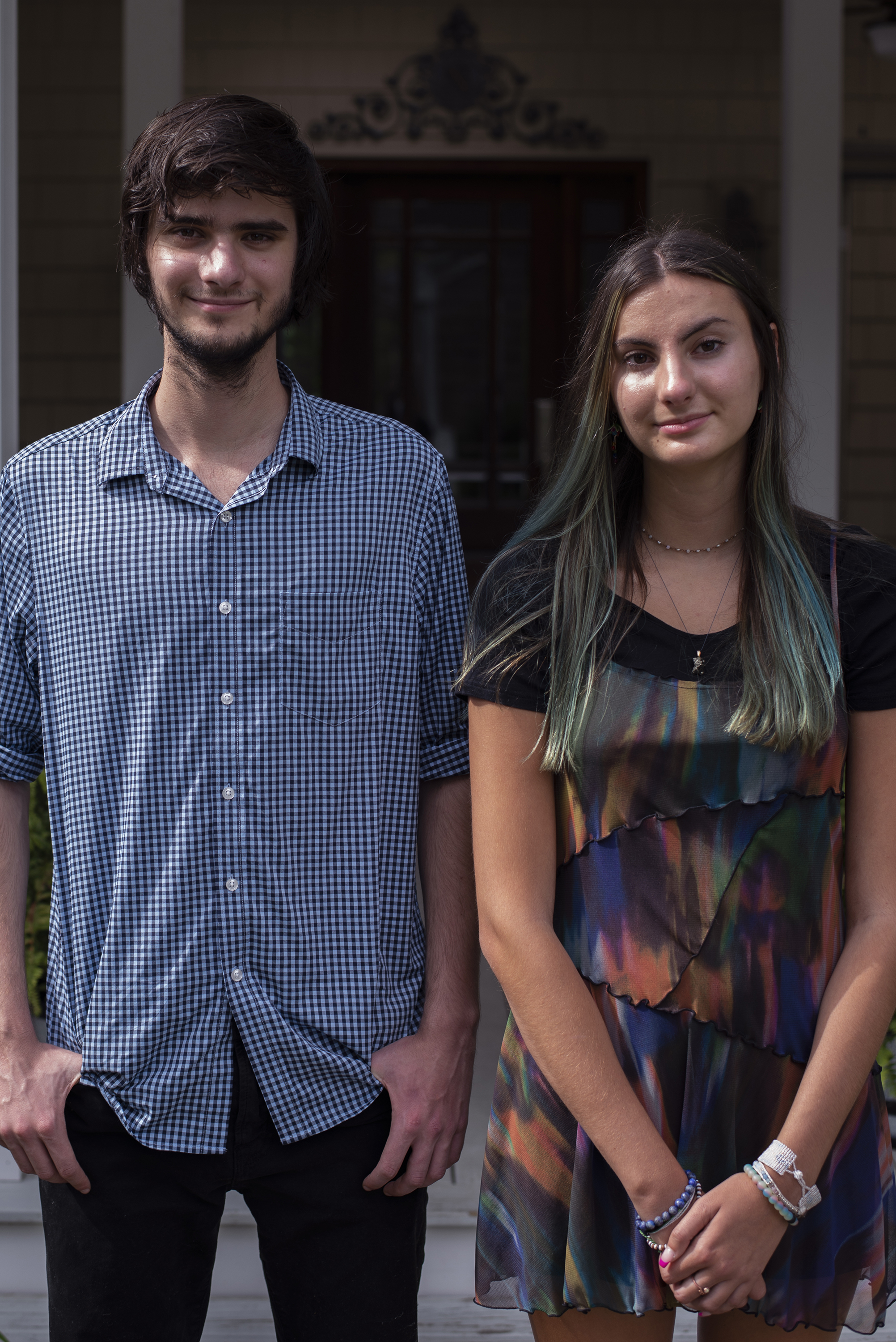 caption: A.J. and Angelica Niedermeyer in front of their house in Wall Township, N.J., on Aug. 19.
