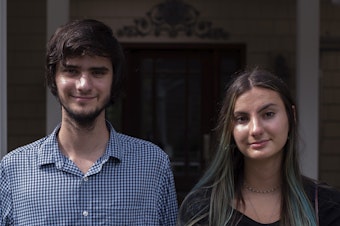 caption: A.J. and Angelica Niedermeyer in front of their house in Wall Township, N.J., on Aug. 19.