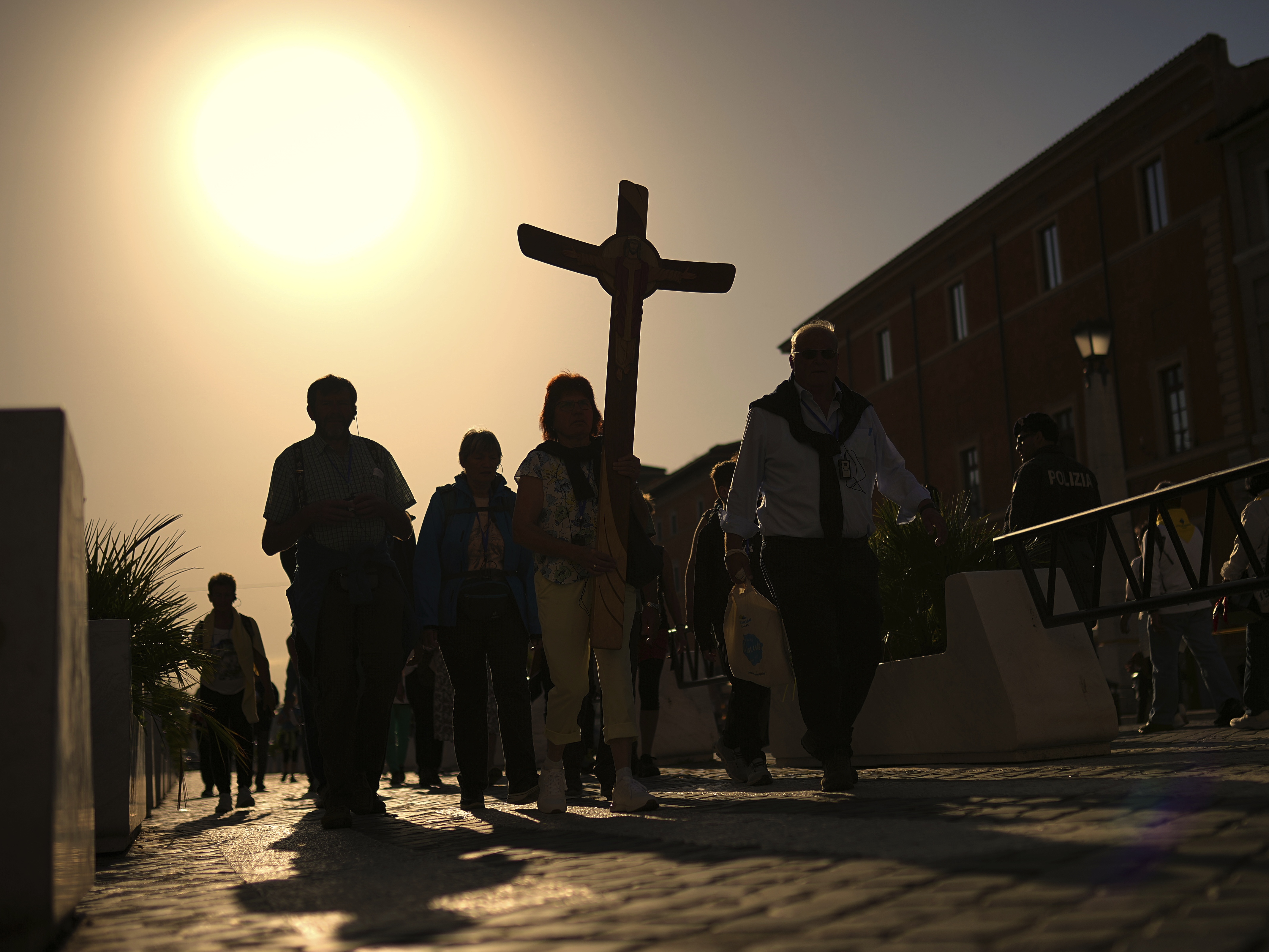 caption: Pilgrims arrive in St. Peter's Square at the Vatican, Tuesday, April 22, 2025.