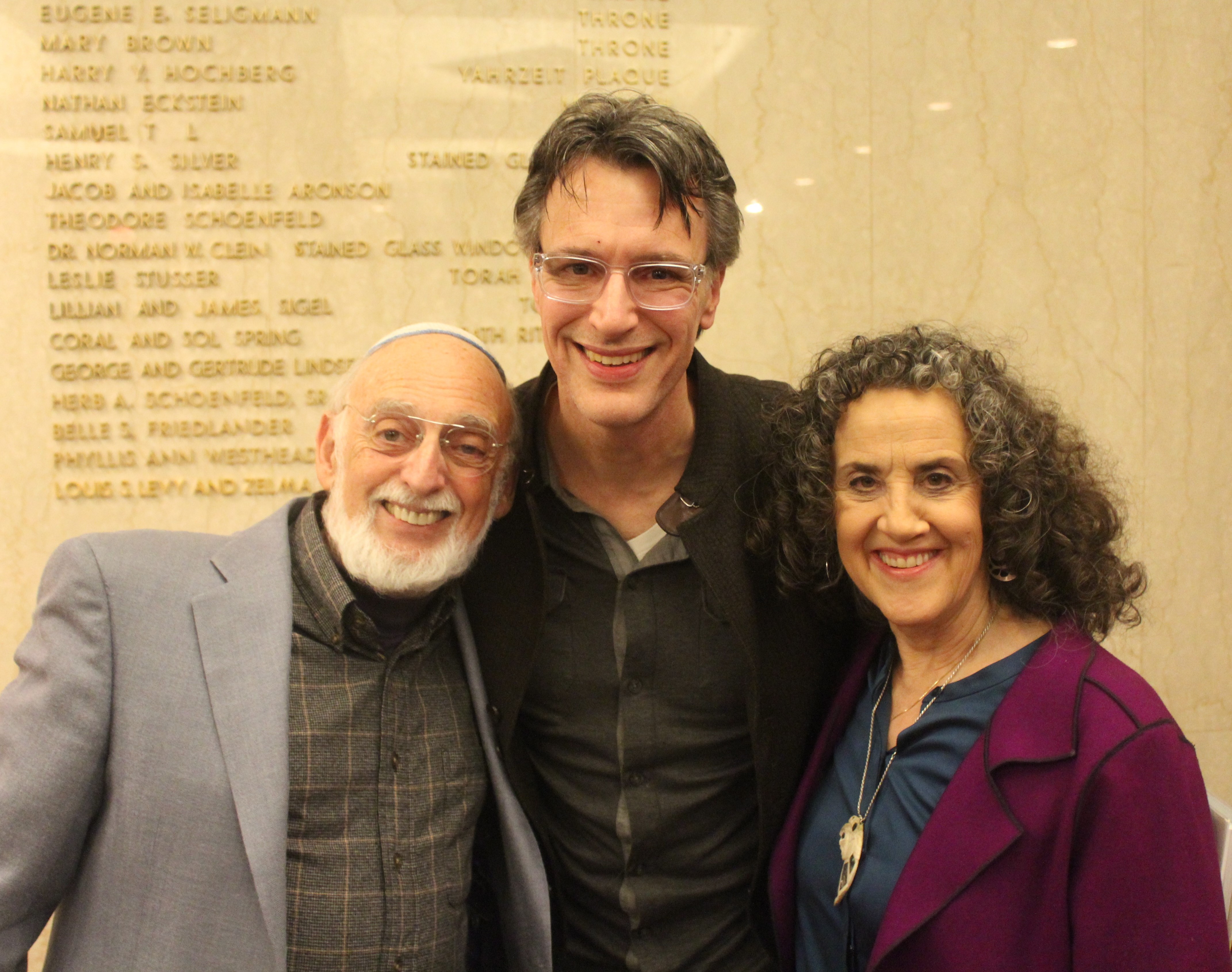 caption: Dr. John Gottman, KUOW's Bill Radke and Dr. Julie Gottman at Temple De Hircsh Sinai
