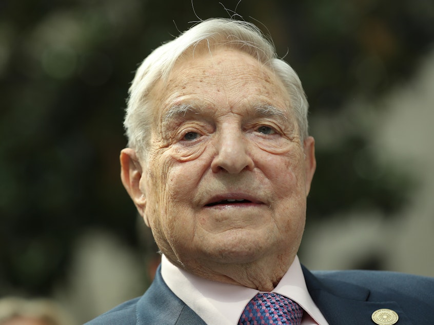 caption: Financier and philanthropist George Soros attends the official opening of the European Roma Institute for Arts and Culture at the German Foreign Ministry in June 2017.
