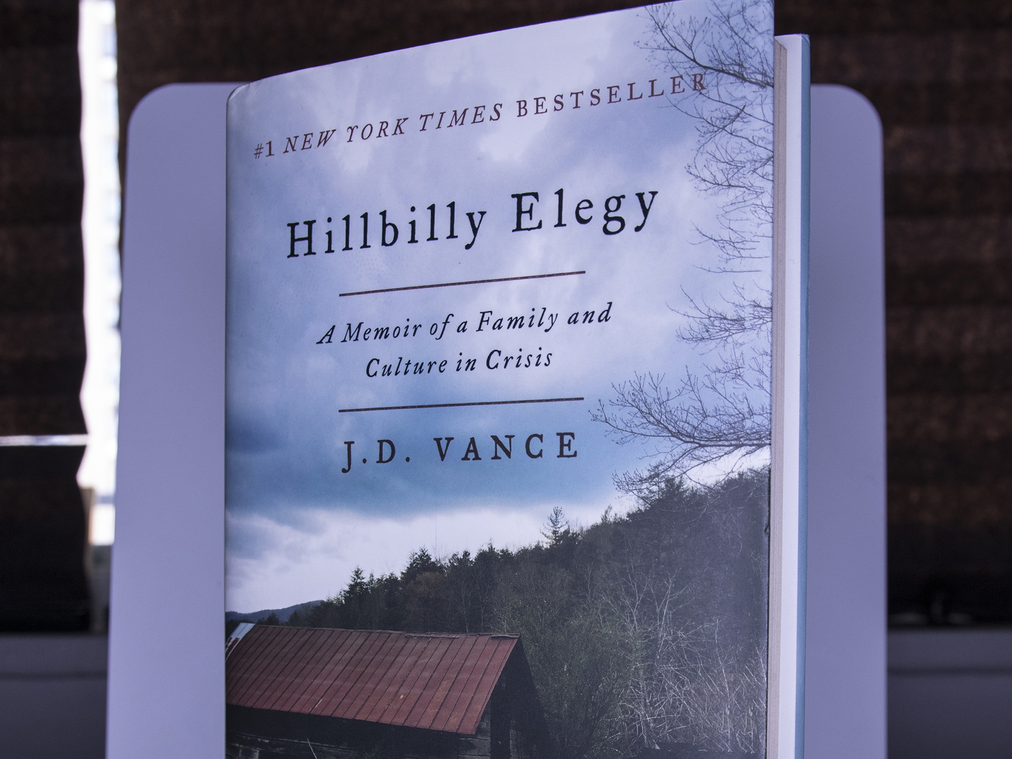 caption: A photograph of <em>Hillbilly Elegy </em>by JD Vance.